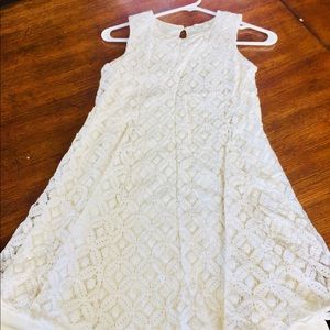 White lace dress with a blue jacket